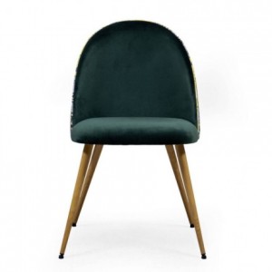 Silla de comedor MADEIRA tapizada en terciopelo verde, con respaldo curvo y trasera estampada tropical. Patas simil madera